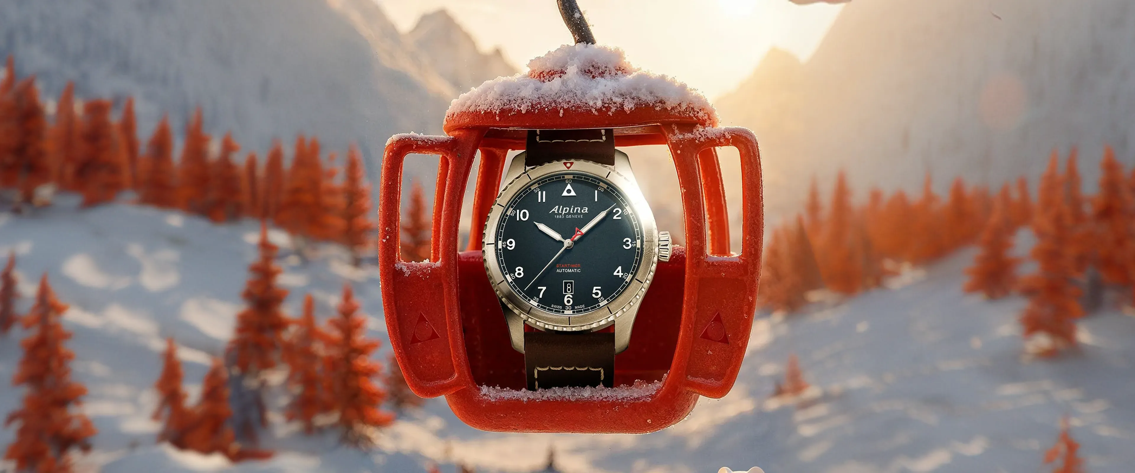Luxury Alpina wristwatch displayed in a red ski gondola against a snowy alpine mountain landscape