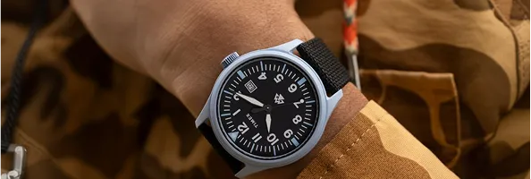 Rugged military style watch with dark dial