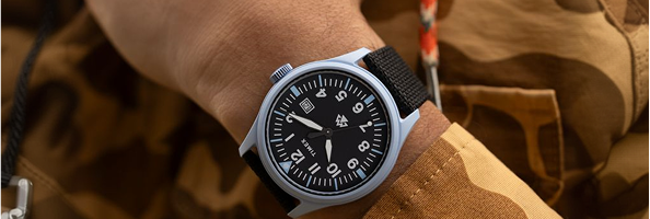 Rugged military style watch with dark dial